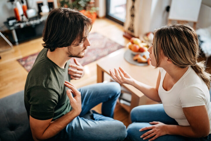 couple arguing on couch