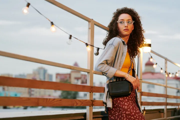 serious woman leaning on fence