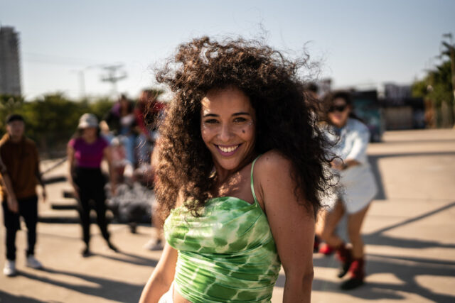 smiling woman outdoors with friends